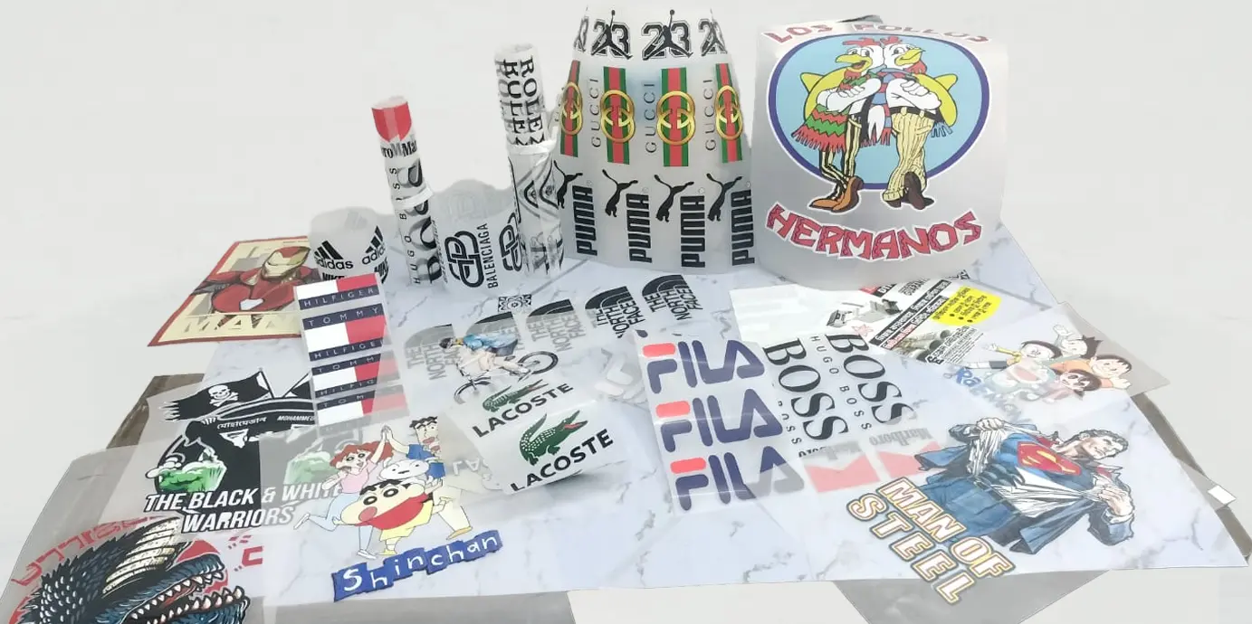 A collection of premium DTF films stacked and ready for use, produced in Narayanganj, Bangladesh. These high-quality films are ideal for heat transfer printing on garments, offering bold color output and strong durability — perfect for T-shirt printing businesses across Bangladesh.